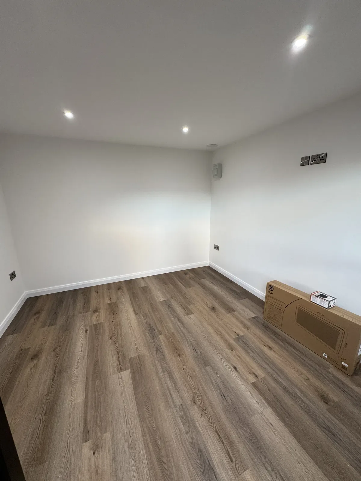 Finished garden room interior with wood-effect flooring